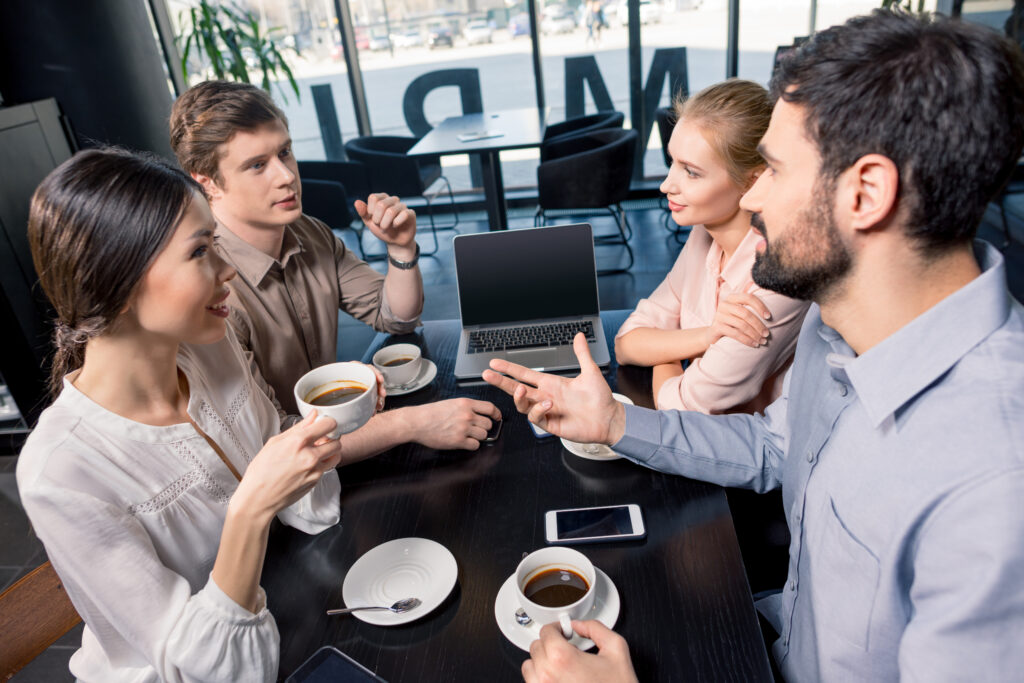 Group of People drinking Coffee in Social Gathering
