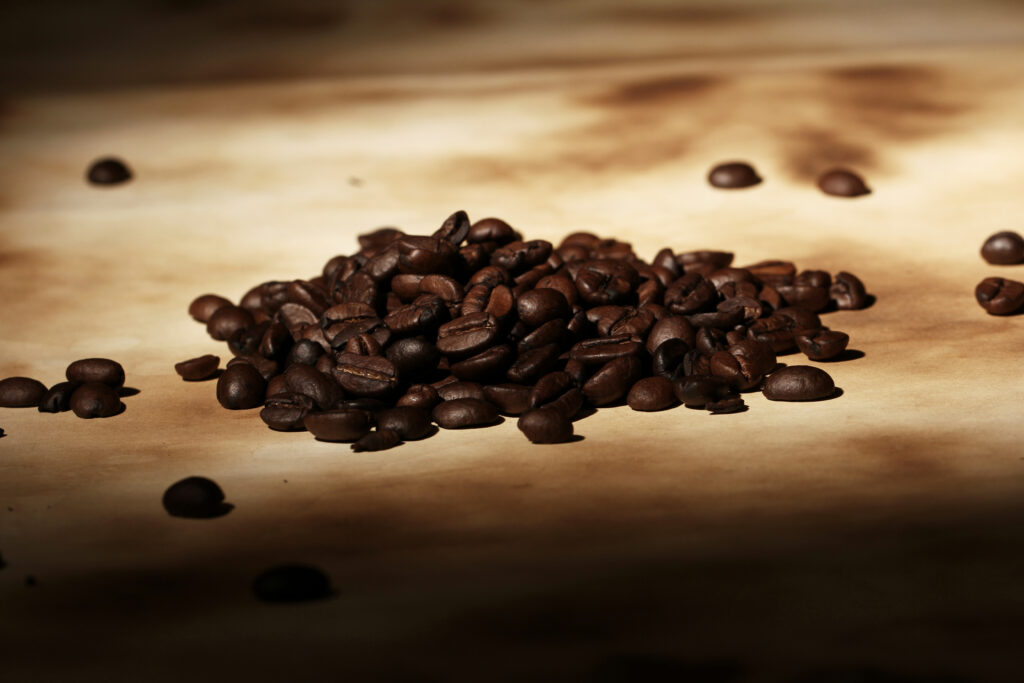 Pile of dark-roasted coffee beans