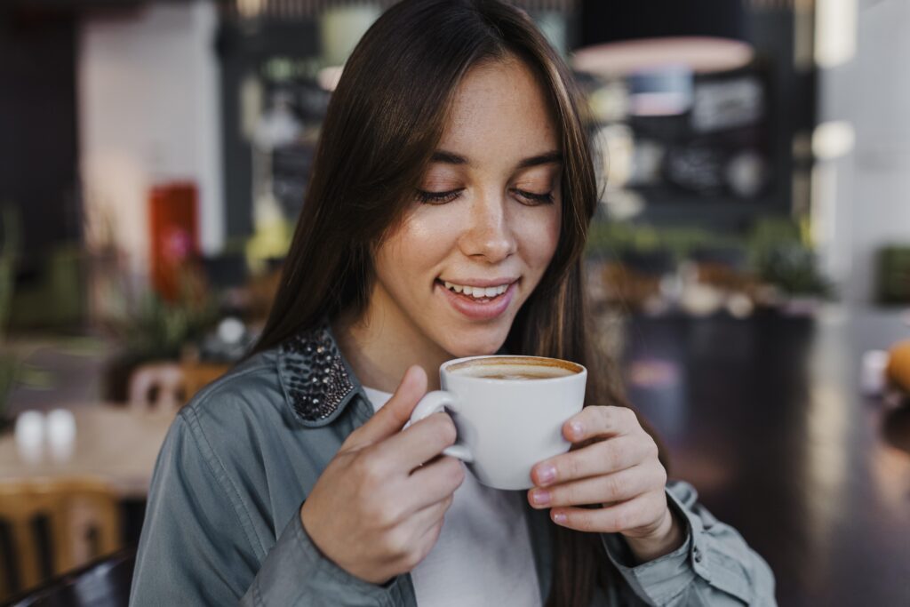 Woman enjoying a coffee cup
